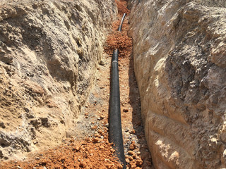 The high voltage electrical cable is laid in a trench	