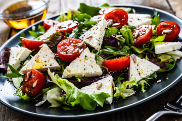 Fresh greek salad - feta cheese, tomato, lettuce, black olives and onion