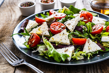 Fresh greek salad - feta cheese, tomato, lettuce, black olives and onion