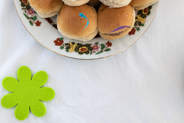 Italian party panini piled in stack in finger food style. Small panini sandwich with ham and salami. Italian food birthday party with flag. Happy food italian catering banquet with prosciutto