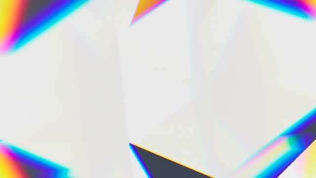 Prism separating a ray of light into the seven colors of the spectrum. Light source rotates, giving beautiful rainbow effects. 4k