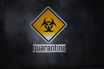 Quarantine. Quarantine warning sign on a glass door in a hospital isolator. Isolation of patients...