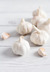 Several garlic on wooden background