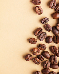  A handful of arabica coffee beans. Vertical photo with place for text for coffee houses,...