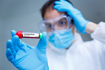 Corona Virus in Lab. Scientist hold Blood Test. New Epidemic Coronavirus 2019 nCoV