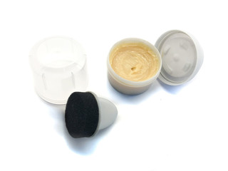 Shoe polish isolated on a white background. Water-repellent shoe polish. Shoe wax. Cream and sponge for shoe care.