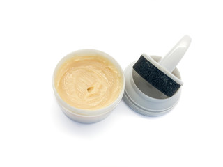 Shoe polish isolated on a white background. Water-repellent shoe polish. Shoe wax. Cream and sponge...