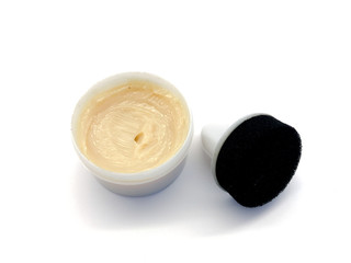 Shoe polish isolated on a white background. Water-repellent shoe polish. Shoe wax. Cream and sponge...