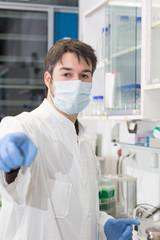 Fototapeta premium man working in the lab pointing finger at camera