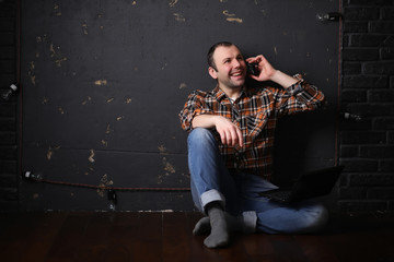 Male architect builder in a protective helmet