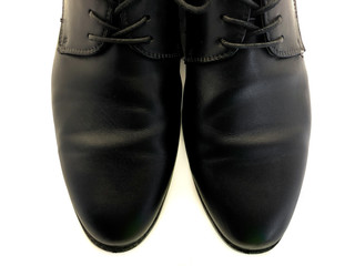 Men's shoes isolated on a white background. Black men's shoes. Men's clothing. Classic style. Business shoes. Shoelaces for shoes.