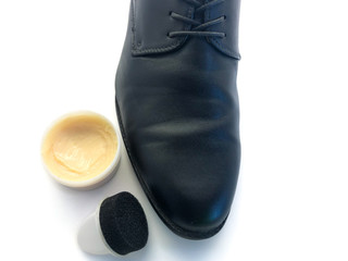 Men's shoes and shoe polish isolated on white background. Male shoes. Set of wax for shoes. To...