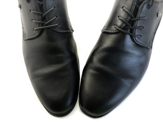 Men's shoes isolated on a white background. Black men's shoes. Men's clothing. Classic style. Business shoes. Shoelaces for shoes.