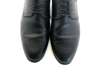 Men's shoes isolated on a white background. Black men's shoes. Men's clothing. Classic style. Business shoes. Shoelaces for shoes.