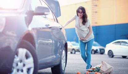 Girl with food coming out of the grocery store