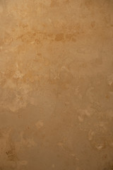 Ancient beige marble wall, background.