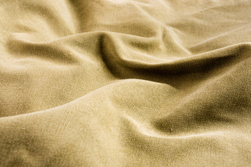 clothing items stonewashed cotton fabric texture with seams, clasps, buttons and rivets, macro