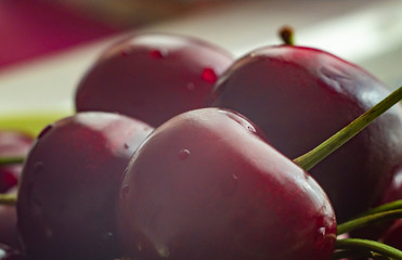 Red ripe cherries with blurred background. Macro view. Texture.