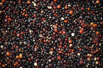 Quinoa Black grains background, flat lay backdrop. Gluten free Healthy food. Diet, dieting concept. Seeds of black quinoa - Chenopodium quinoa
