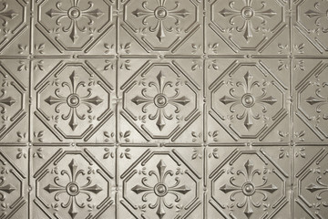Silver or tin pressed metal wall panelling. Retro, vintage wall or ceiling panelling. 