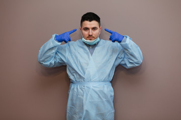 Obraz premium young doctor showing gestures, coronavirus concept