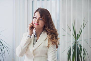 Young woman working in office on her working place