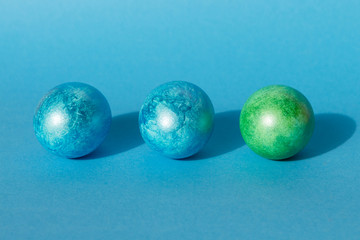 Colorful easter eggs on blue background. Happy Easter composition. Copy space.