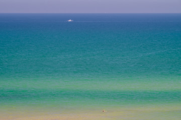 Shades of the sea and blue sky.