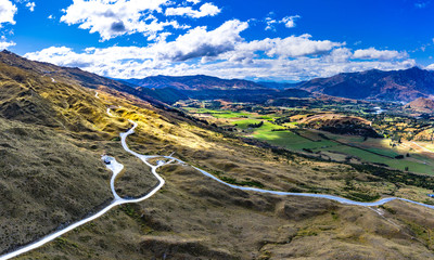 Aerial Panorama of The Coronet Peak and Skippers Road entrance. Arrowtown in the background.
