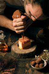 chef plating sweet dessert with ice cream