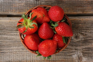 Delicious juicy strawberries on a wooden table