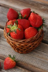Delicious juicy strawberries on a wooden table