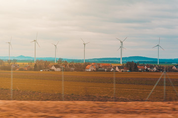 Windmills in mountain fields on the border of Germany and Poland