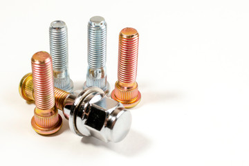 nuts and studs for a car on a table