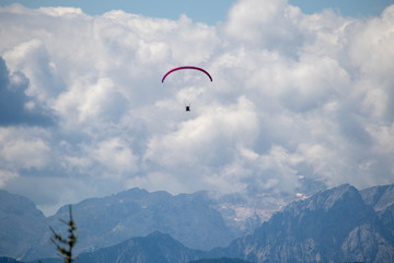 Panorama of the Austrian Alps,Europe,at Lake Ossiacher See with the mountains of the Karawanken Mountains with paragliders