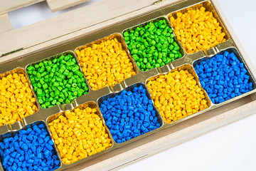 Polymeric dye. Plastic pellets. Colorant for plastics. Pigment in the granules.