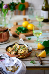 Pork picatta in copper bowl. style rustic