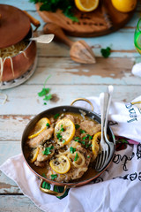 Pork picatta in copper bowl. style rustic