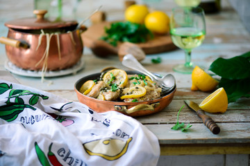 Pork picatta in copper bowl. style rustic