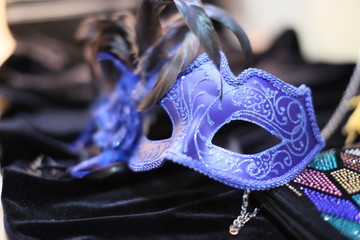 On black velvet dress blue mask from  masquerade
