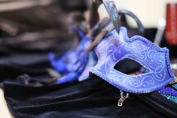 On black velvet dress blue mask from  masquerade