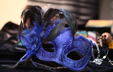 On black velvet dress blue mask from  masquerade