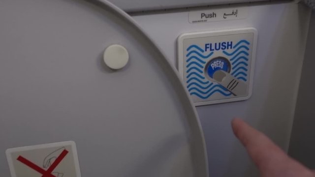 Water flushing down into the toilet bowl in Airplane