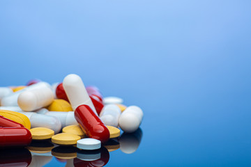 Blue horizontal photo with pills in pile stock photo