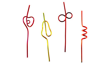 Colored straws for a cocktail of different shapes on a white background.