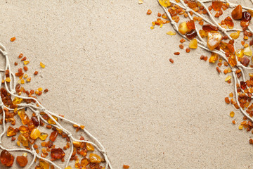 Ambers On Sand Background