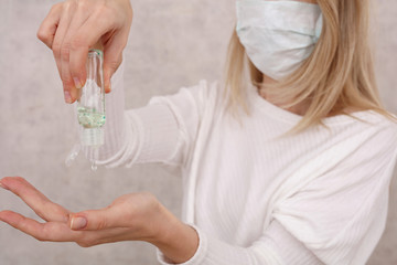Antibacterial hands disinfection. Woman using hand sanitizer , Coronavirus Protection routine,...