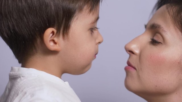 mother and son in white t-shirts on a white background