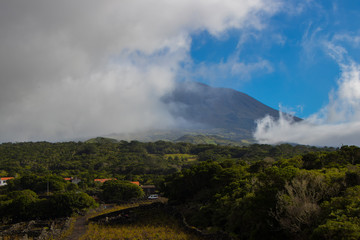 Pico mountain, lava rock, Madalena, Pico, Azores islands, Portugal. Panoramic landscape view.