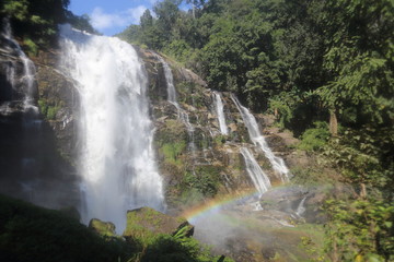 Fototapeta premium Wachirathan waterfall and rainbow at Doi Inthanon national park, Chiang Mai, Thailand
